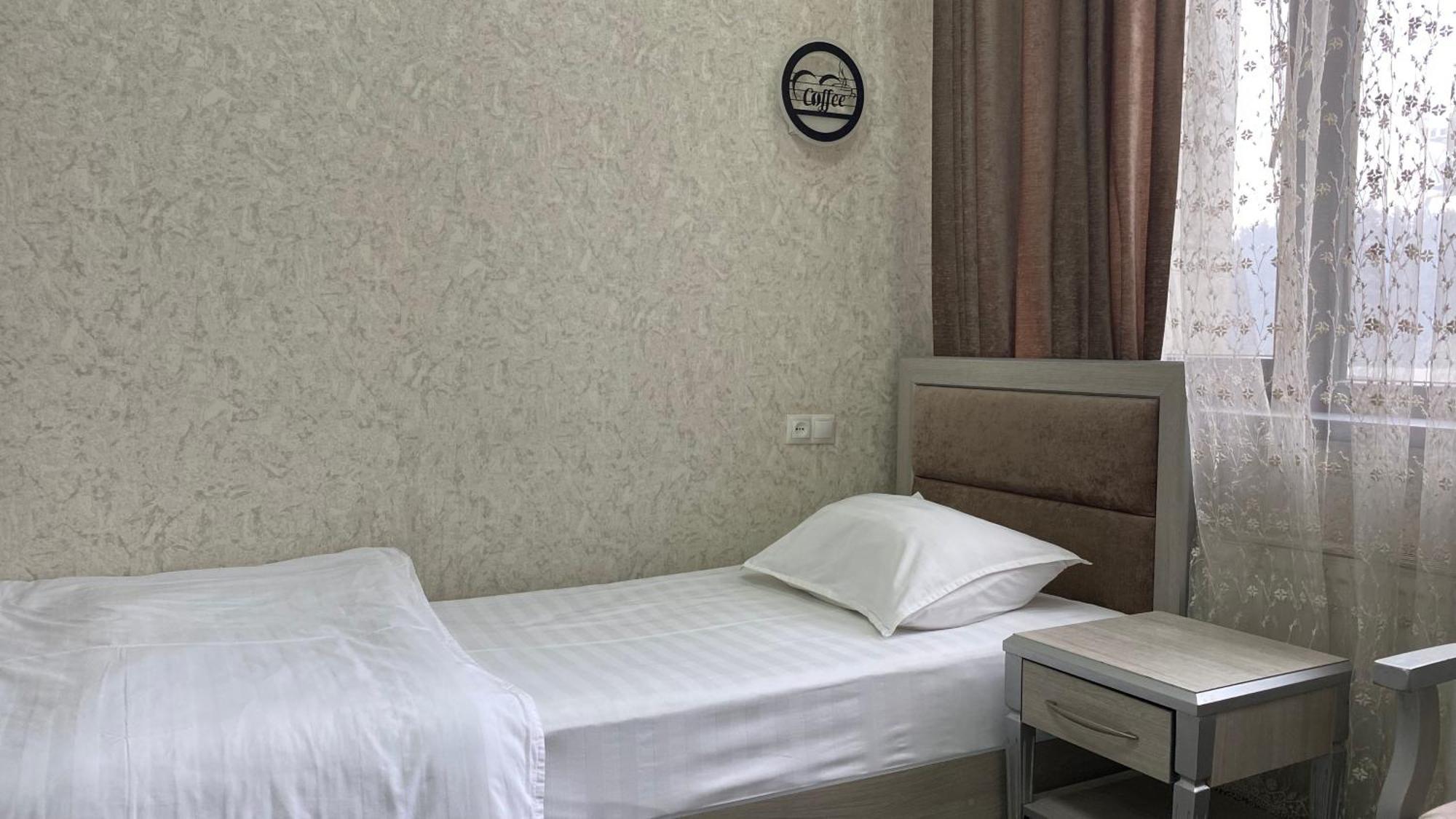 Diyor Hotel Marghilon Exterior photo